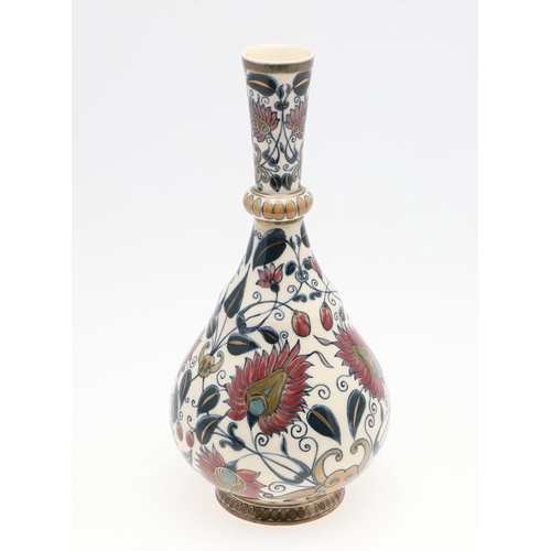 722 - ZSOLNAY PECS VASE. A bottle shaped vase painted with a Persian style design of flowers and leaves. M... 