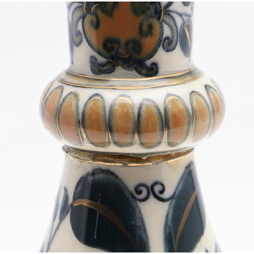 722 - ZSOLNAY PECS VASE. A bottle shaped vase painted with a Persian style design of flowers and leaves. M... 