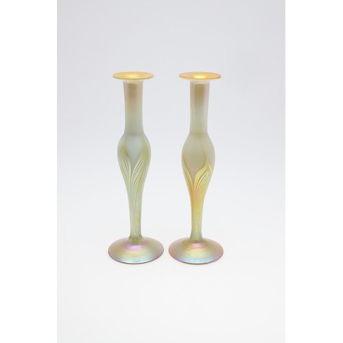 725 - LOUIS COMFORT TIFFANY - PAIR OF FAVRILE IRIDESCENT GLASS VASES. A pair of slender iridescent glass v... 