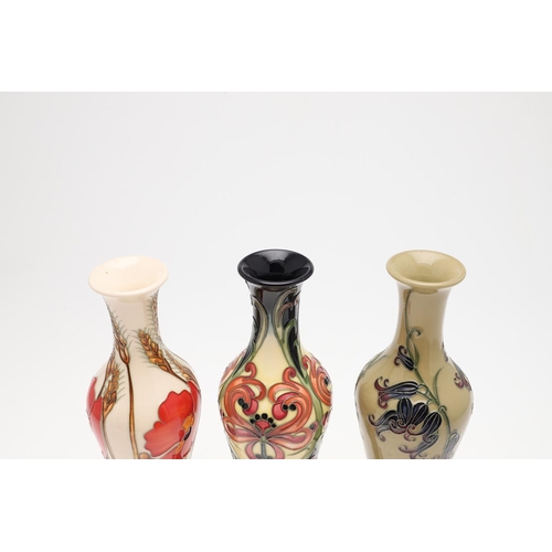 730 - MOORCROFT - THREE MODERN VASES INCLUDING POPPY HARVEST. Including a large slender vase in the 'Poppy... 