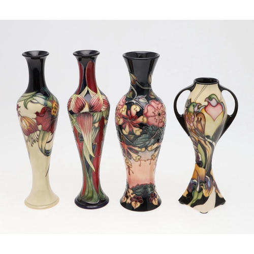 731 - MOORCROFT - FOUR MODERN VASES INCLUDING 'TRINITY'. Including a large slender vase in the 'Anna Lily'... 