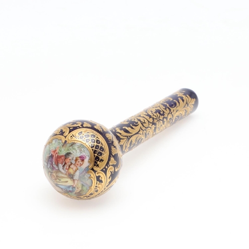 745 - CONTINENTAL PORCELAIN PARASOL HANDLE. Probably French, the top painted with a courting couple within... 