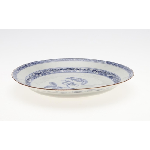 793 - 18THC CHINESE BLUE & WHITE DISH. An 18thc dish or bowl of shallow form, painted with a central flowe... 