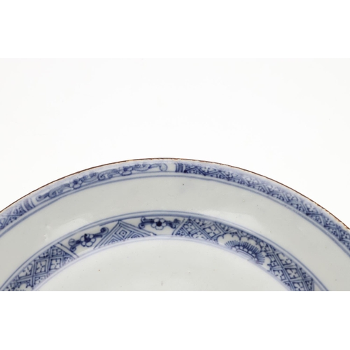 793 - 18THC CHINESE BLUE & WHITE DISH. An 18thc dish or bowl of shallow form, painted with a central flowe... 