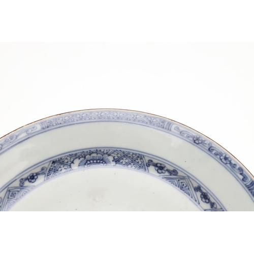 793 - 18THC CHINESE BLUE & WHITE DISH. An 18thc dish or bowl of shallow form, painted with a central flowe... 