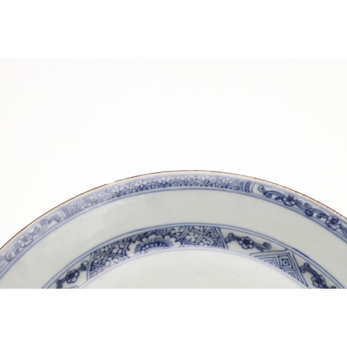 793 - 18THC CHINESE BLUE & WHITE DISH. An 18thc dish or bowl of shallow form, painted with a central flowe... 