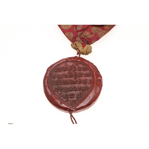 809 - OTTOMAN - A RARE PERSIAN LETTER BAG (KHARITA) & WAX SEAL. A 19thc silk woven bag with gold coloured ... 