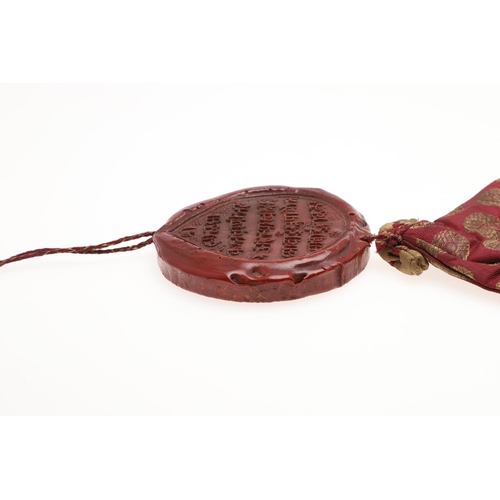 809 - OTTOMAN - A RARE PERSIAN LETTER BAG (KHARITA) & WAX SEAL. A 19thc silk woven bag with gold coloured ... 