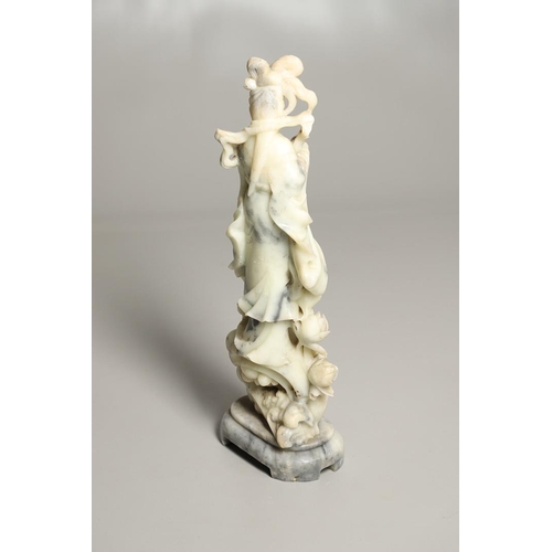 823 - LARGE CHINESE CARVED SOAPSTONE FIGURE. 20thc, an unsually large carved soapstone figure of a pale gr... 