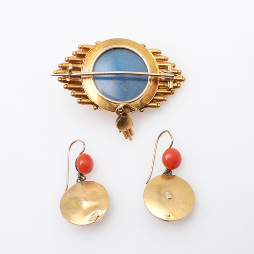 1000 - A VICTORIAN CORAL AND GOLD BROOCH. the gold mount is centred with a circular coral cabochon, with lo... 