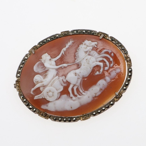 1015 - A CARVED SHELL CAMEO BROOCH. of oval-shape, depicting, possibly a representation of Aurora, mounted ... 