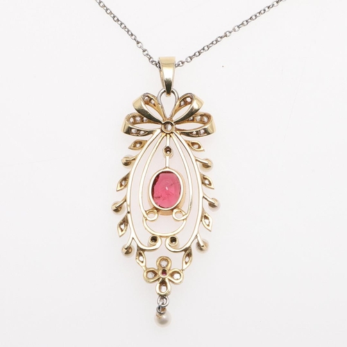 1022 - AN EDWARDIAN TOURMALINE, DIAMOND AND PEARL PENDANT. the oval-shaped red tourmaline is set within a f... 