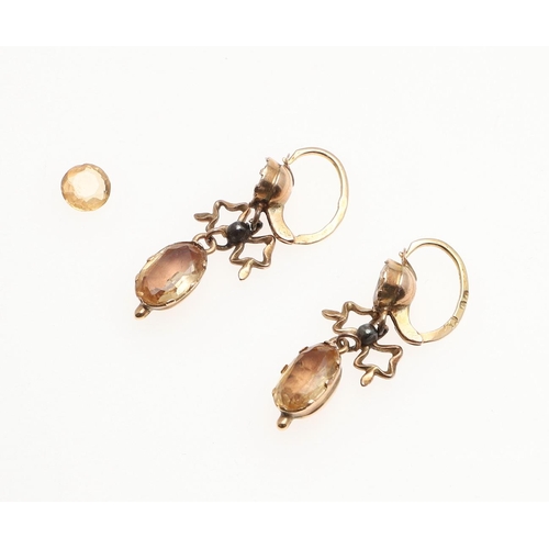 1024 - A PAIR OF GEORGIAN TOPAZ DROP EARRINGS. each earring mounted with foil backed topazes in gold closed... 