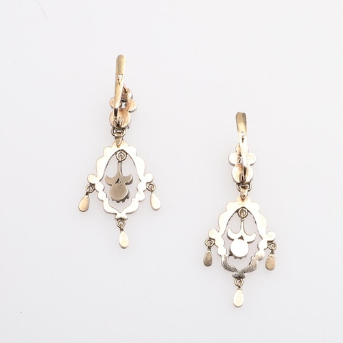 1025 - A PAIR OF VICTORIAN PASTE SET DROP EARRINGS. each earring of openwork scrolling form, mounted with w... 