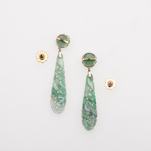 1037 - A PAIR OF JADE AND GOLD DROP EARRINGS. each formed with a drop of carved and pierced jade suspended ... 