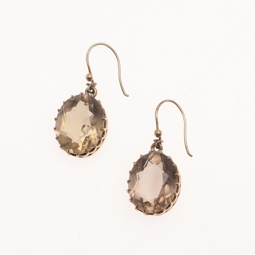 1039 - A PAIR OF SMOKY QUARTZ DROP EARRINGS. each earring mounted with an oval-shaped smoky quartz in gold,... 