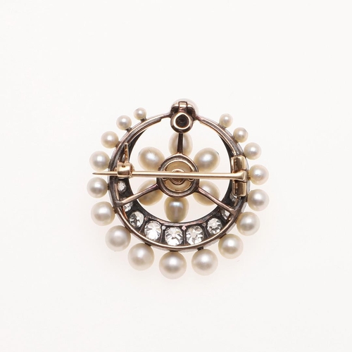 1042 - A DIAMOND AND PEARL CRESCENT BROOCH PENDANT. the crescent mounted with graduated old cut diamonds, w... 