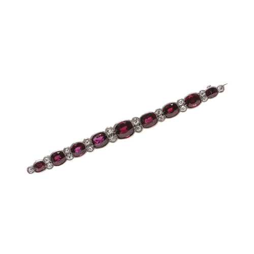 1043 - A RUBY AND DIAMOND BROOCH. mounted with graduated oval-shaped rubies and rose-cut diamonds, 6.5cm lo... 