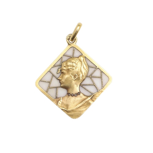 1054 - AN ART NOUVEAU PLIQUE A JOUR ENAMEL, GOLD AND DIAMOND PENDANT. depicting the profile of a lady weari... 