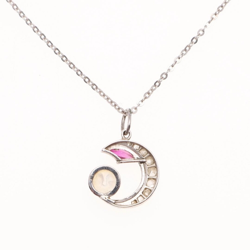 1056 - A MOONSTONE, RUBY AND DIAMOND MAN IN THE MOON PENDANT. mounted with a carved moonstone, graduated ol... 