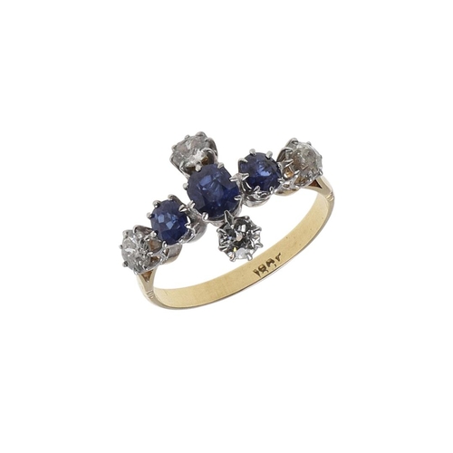 1071 - A SAPPHIRE AND DIAMOND QUATREFOIL CLUSTER RING. mounted with three oval-shaped sapphires and four ci... 