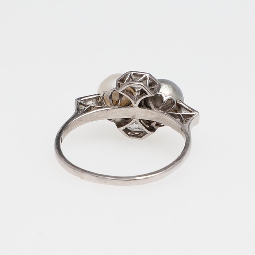 1072 - A DIAMOND AND PEARL RING. mounted with an untested grey cultured pearl and a white cultured pearl, a... 