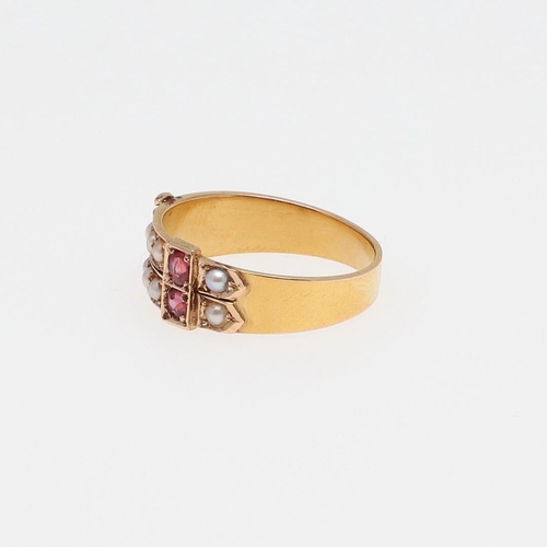 1076 - A VICTORIAN RUBY AND PEARL SET BUCKLE RING. mounted with two circular-cut rubies and half pearls in ... 