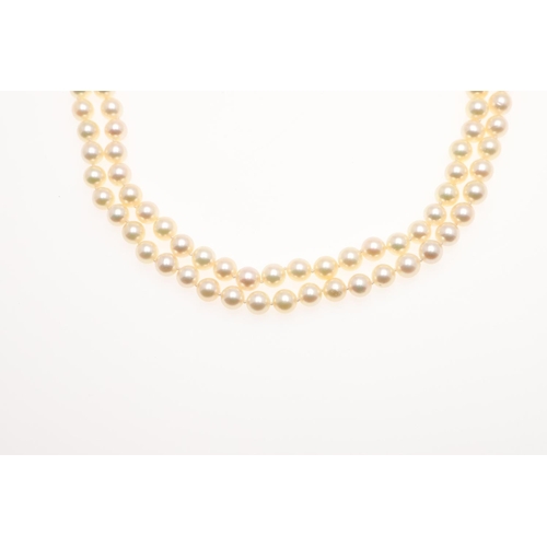 1082 - A DOUBLE ROW CULTURED PEARL CHOKER. the pearls measure approximately 7.6mm and are set to a 9ct gold... 