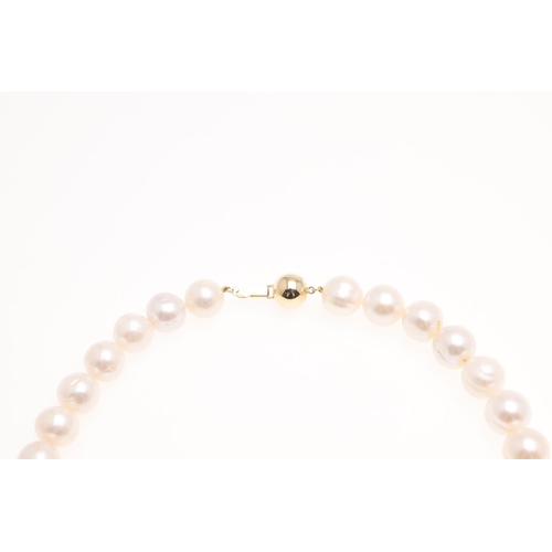 1083 - A SINGLE ROW UNIFORM CULTURED PEARL NECKLACE. the pearls measure approximately 12.0mm and are set to... 