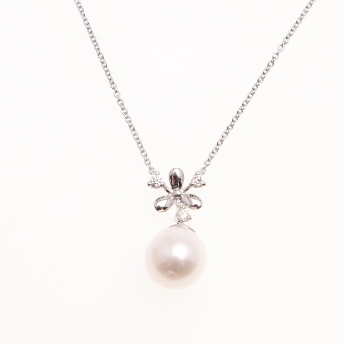 1084 - A CULTURED PEARL AND DIAMOND PENDANT. mounted with a cultured pearl measuring approximately 9.1mm su... 