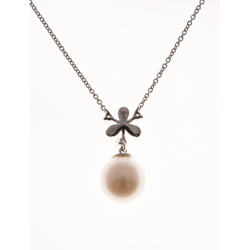 1084 - A CULTURED PEARL AND DIAMOND PENDANT. mounted with a cultured pearl measuring approximately 9.1mm su... 