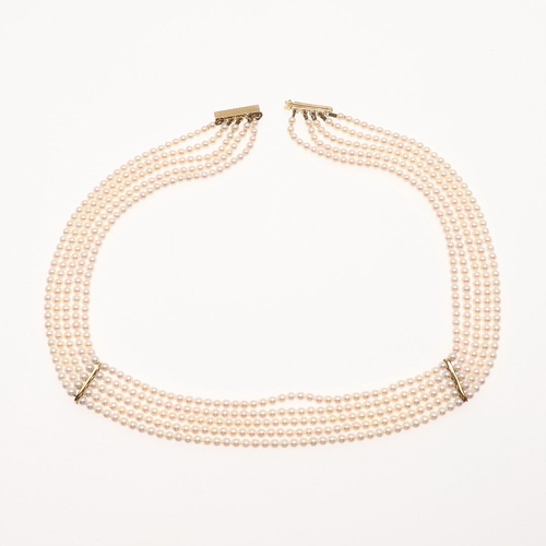 1085 - A FIVE ROW CULTURED PEARL, DIAMOND AND 18CT GOLD CHOKER. the pearls measure approximately 3.0mm and ... 