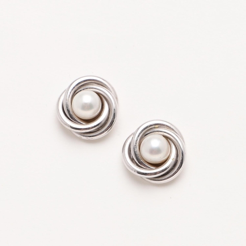 1086 - A PAIR OF CULTURED PEARL AND GOLD STUD EARRINGS. each earring is centred with a cultured pearl withi... 