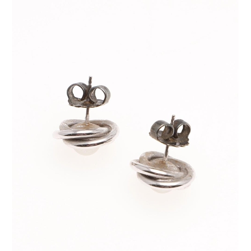 1086 - A PAIR OF CULTURED PEARL AND GOLD STUD EARRINGS. each earring is centred with a cultured pearl withi... 