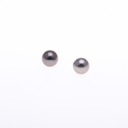 1087 - A PAIR OF BLACK SOUTH SEA CULTURED PEARL STUD EARRINGS. each earring mounted with a black South Sea ... 