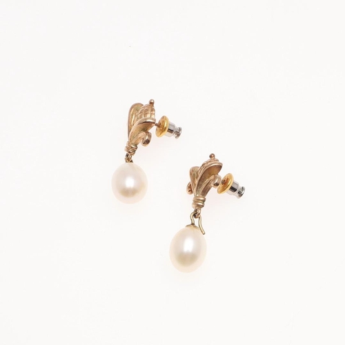 1088 - A PAIR OF CULTURED PEARL AND GOLD DROP EARRINGS. each earring set with a cultured pearl drop suspend... 