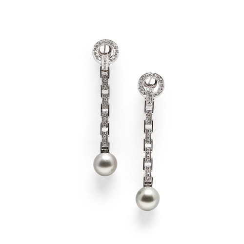 1094 - A PAIR OF DIAMOND AND CULTURED PEARL DROP EARRINGS. each earring formed with a flexible white gold d... 