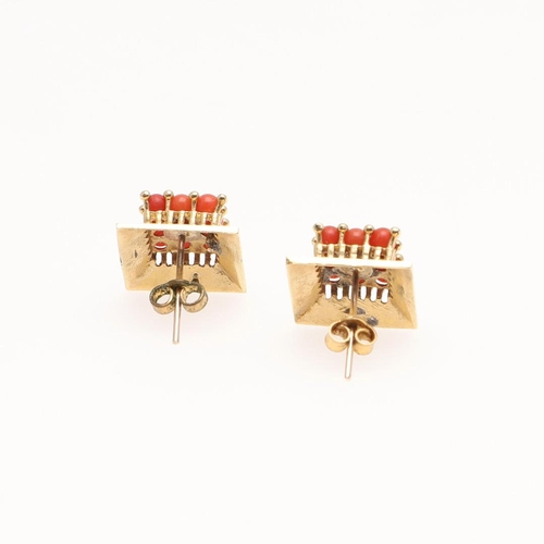 1097 - A PAIR OF CORAL AND GOLD EARRINGS. of square form, each earring mounted with nine coral cabochons, 1... 