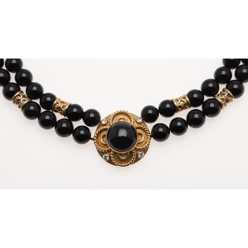 1098 - A BLACK ONYX, DIAMOND AND 18CT GOLD NECKLACE. formed as a double row of black onyx beads to an 18ct ... 