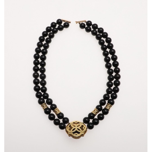 1098 - A BLACK ONYX, DIAMOND AND 18CT GOLD NECKLACE. formed as a double row of black onyx beads to an 18ct ... 