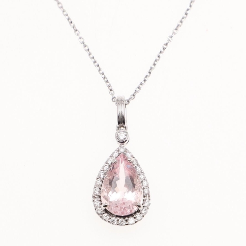 1100 - A MORGANITE AND DIAMOND CLUSTER PENDANT. the pear-shaped morganite weighs 2.75 carats and  is set wi... 