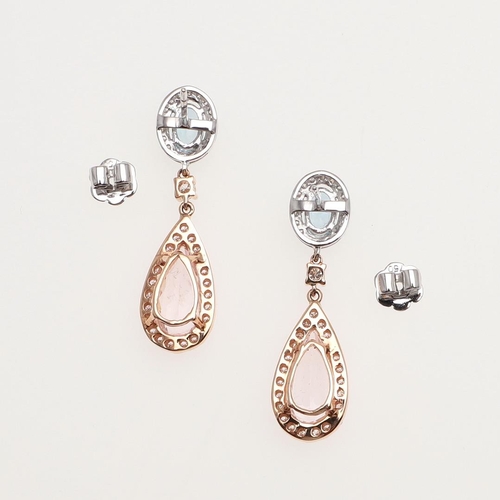 1101 - A PAIR OF MORGANITE, AQUAMARINE AND DIAMOND DROP EARRINGS. each earring mounted with a pear-shaped m... 