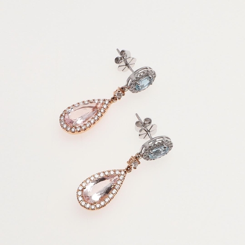 1101 - A PAIR OF MORGANITE, AQUAMARINE AND DIAMOND DROP EARRINGS. each earring mounted with a pear-shaped m... 