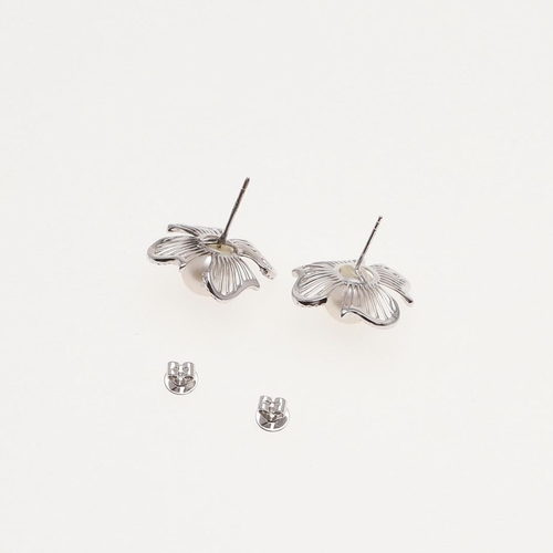 1104 - A PAIR OF CULTURED PEARL AND DIAMOND FLOWERHEAD EARRINGS. the cultured pearl set within four diamond... 