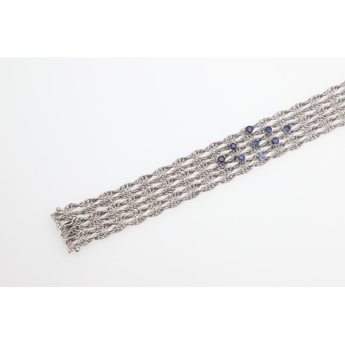 1107 - AN 18CT WHITE GOLD AND SAPPHIRE BRACELET. the woven link gold bracelet is mounted with nine circular... 