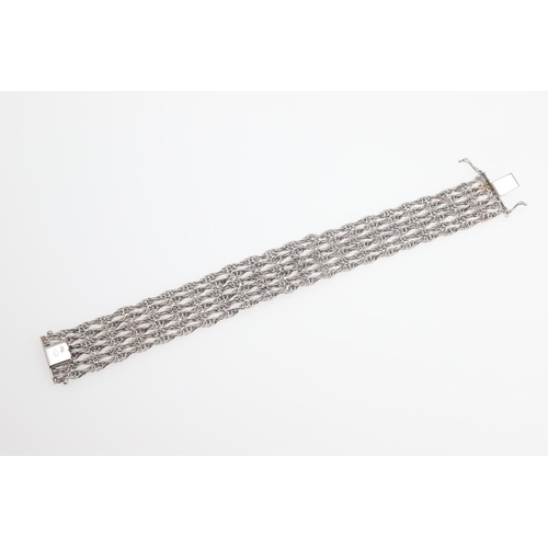 1107 - AN 18CT WHITE GOLD AND SAPPHIRE BRACELET. the woven link gold bracelet is mounted with nine circular... 