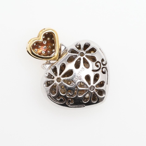 1110 - A DIAMOND AND 18CT GOLD HEART-SHAPED PENDANT. mounted overall with circular-cut diamonds, 2.2cm wide... 