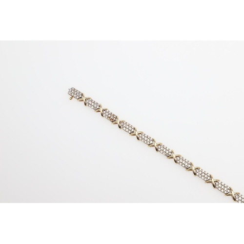 1111 - A DIAMOND AND GOLD BRACELET. formed alternately with sections of circular-cut diamonds and a gold cr... 