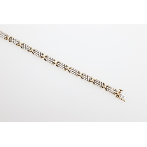 1111 - A DIAMOND AND GOLD BRACELET. formed alternately with sections of circular-cut diamonds and a gold cr... 