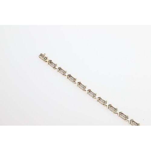 1111 - A DIAMOND AND GOLD BRACELET. formed alternately with sections of circular-cut diamonds and a gold cr... 